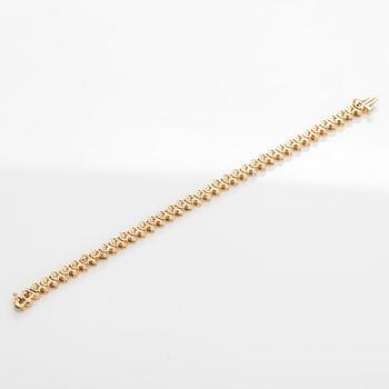 Tennisarmband, 14K guld med briljantslipade diamanter.