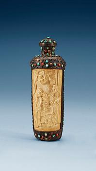 1715. A turquoise inlayed metal framed ivory flask, late Qing dynasty (1644-1911).