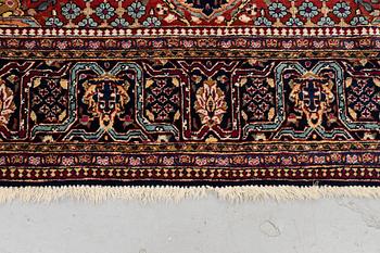 A rug, semi-antique Kashan, ca 216,5 x 140 cm.