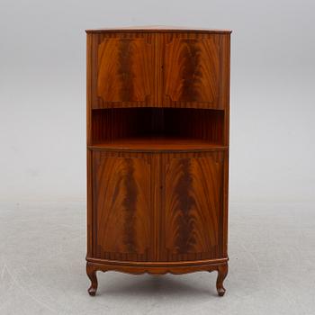 a mahogany corner cabinet.