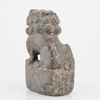 A stone scroll weight/sculpture of a buddhist lion, China, presumably Qing dynasty (1664-1912).