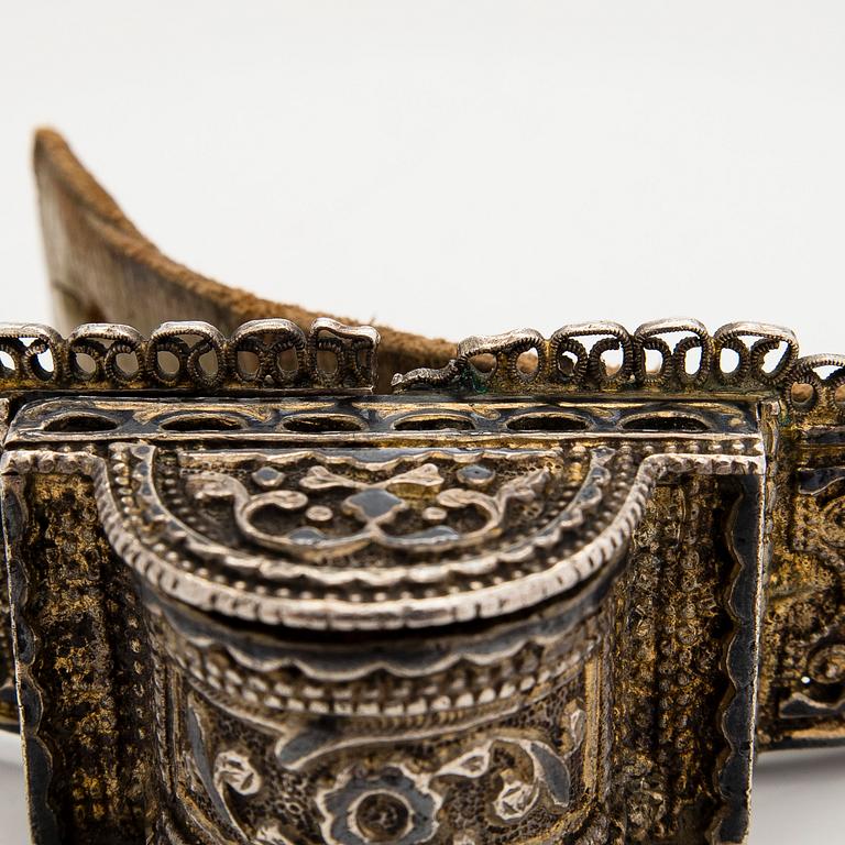 A Caucasian parcel-gilt costume belt with niello decor, 1908-26.