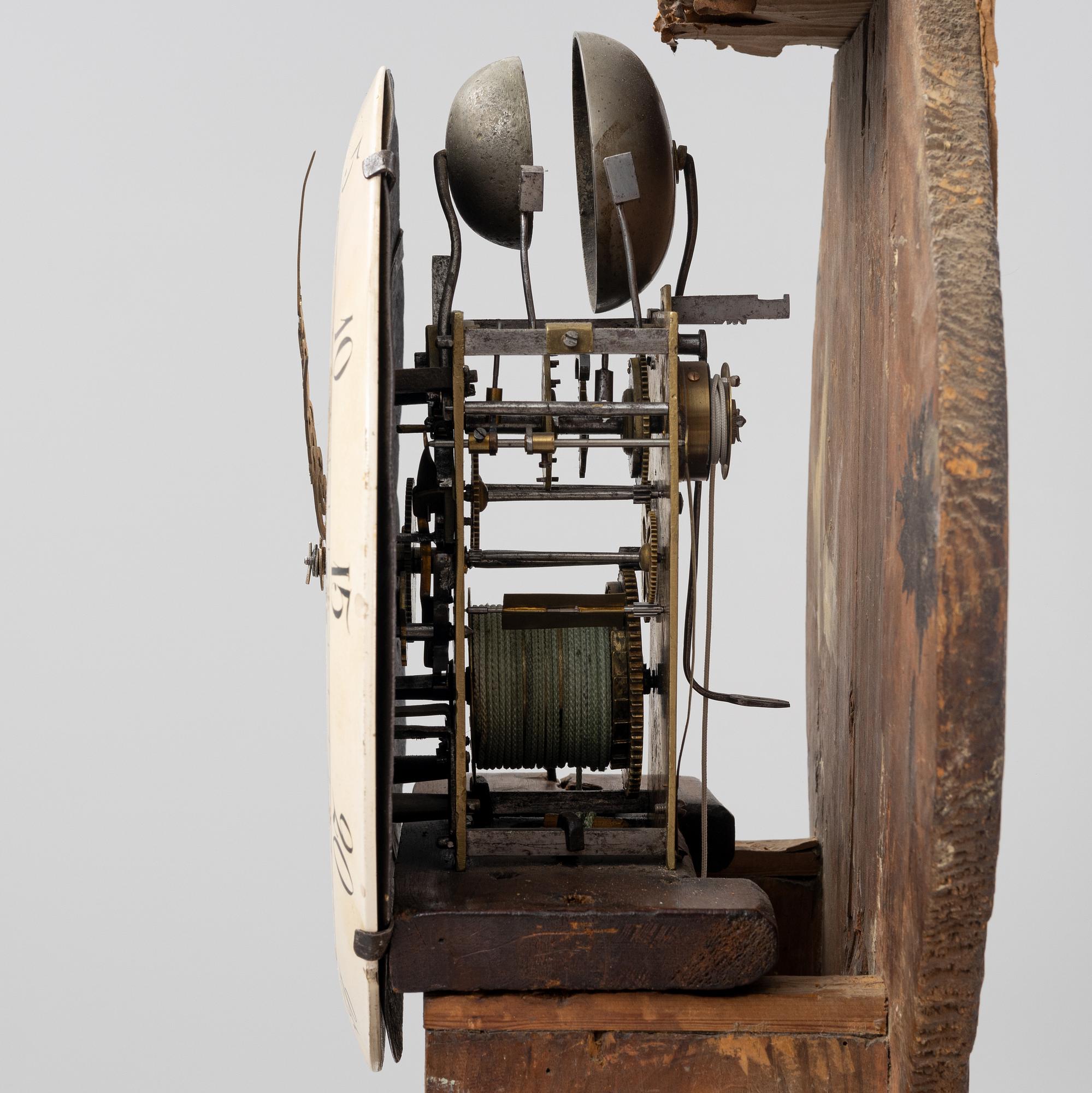A long-case clock, 19th century.