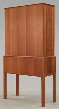 A Carl Malmsten mahogany cabinet with inlays of different types of wood, signed and dated 1958.