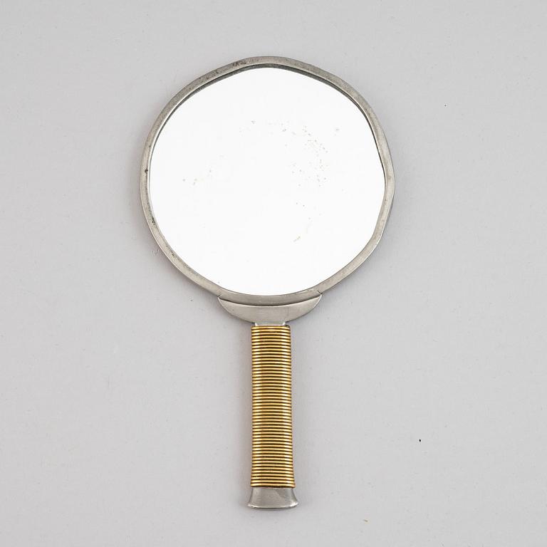 A pewter and brass hand mirror, Svenskt Tenn, 1930's.