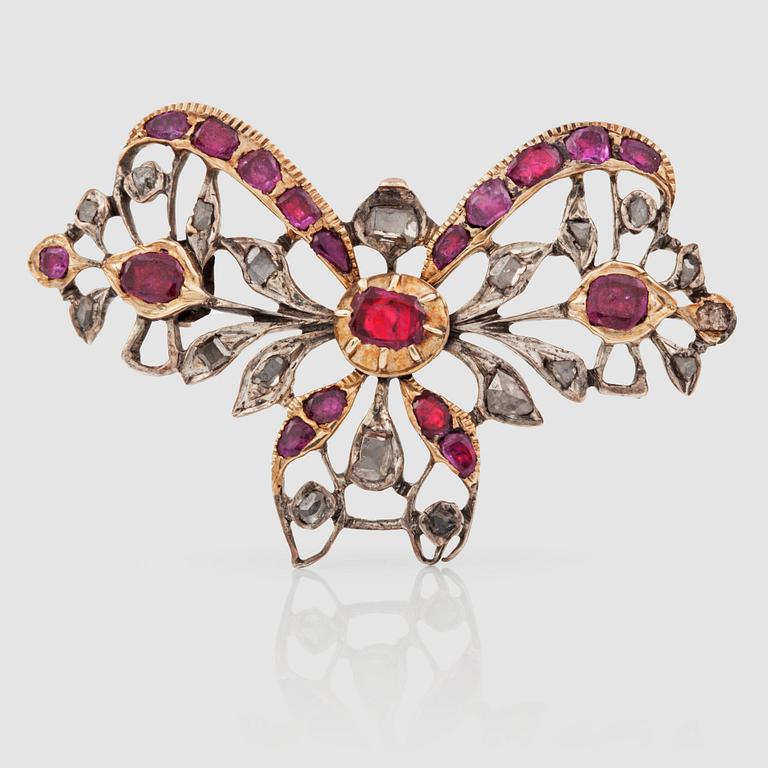 A table-cut diamond and ruby brooch. Possibly Georgian. (Needle later edition).