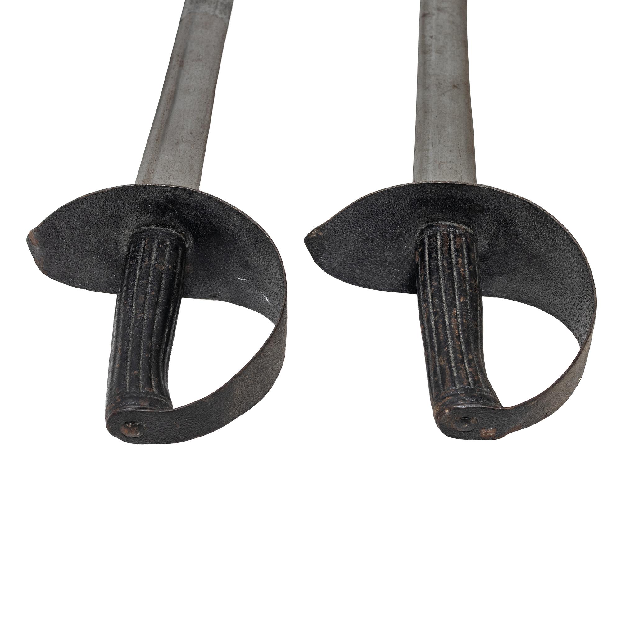 Two 19th century naval cutlasses.
