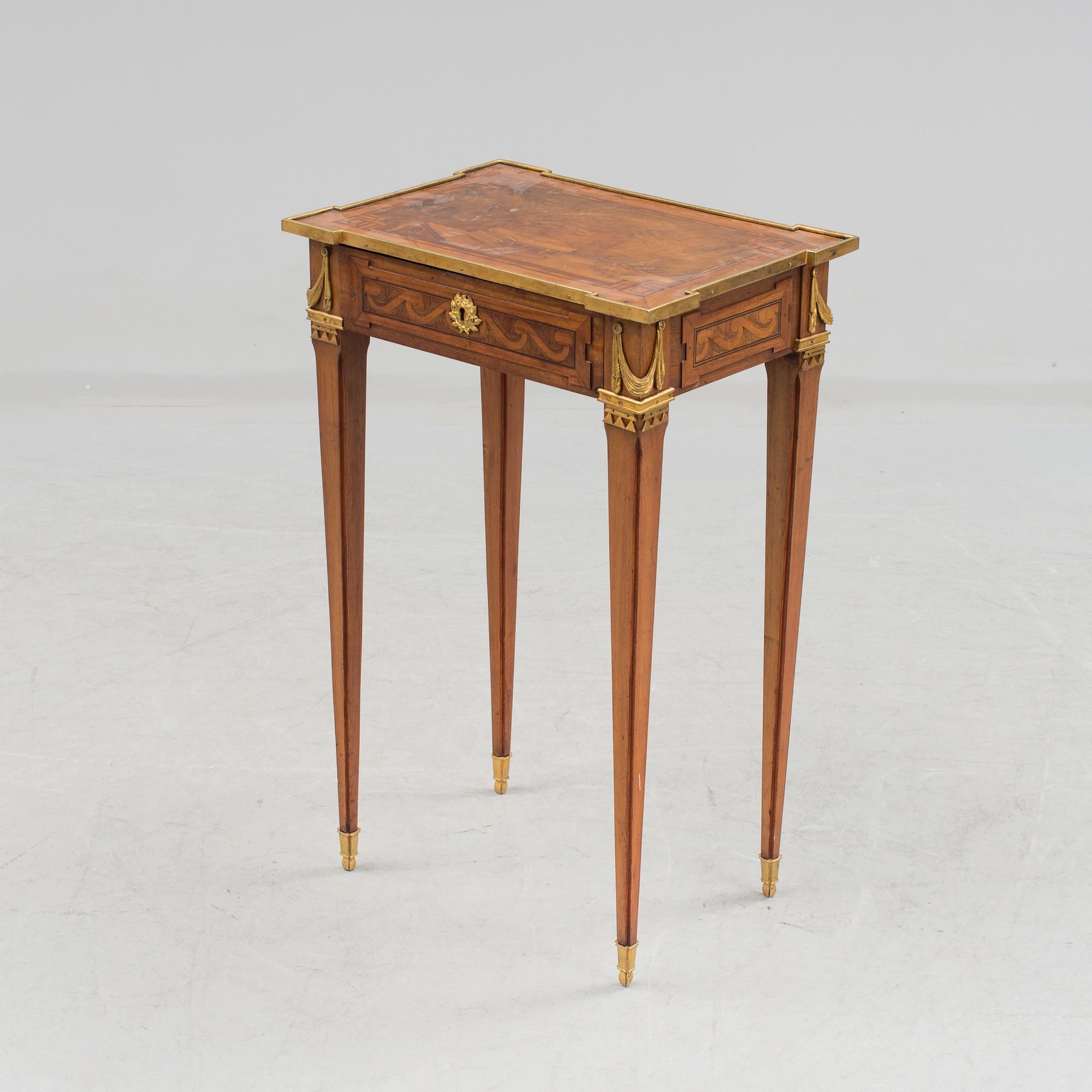 A Louis XVI-style circa 1900 occasional table.