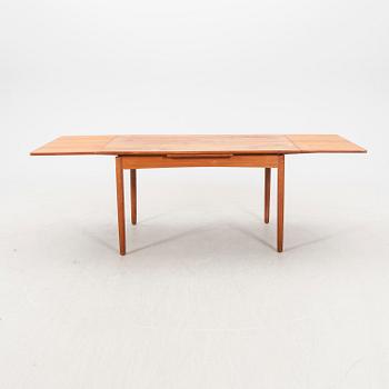A 1960s teak dining table.