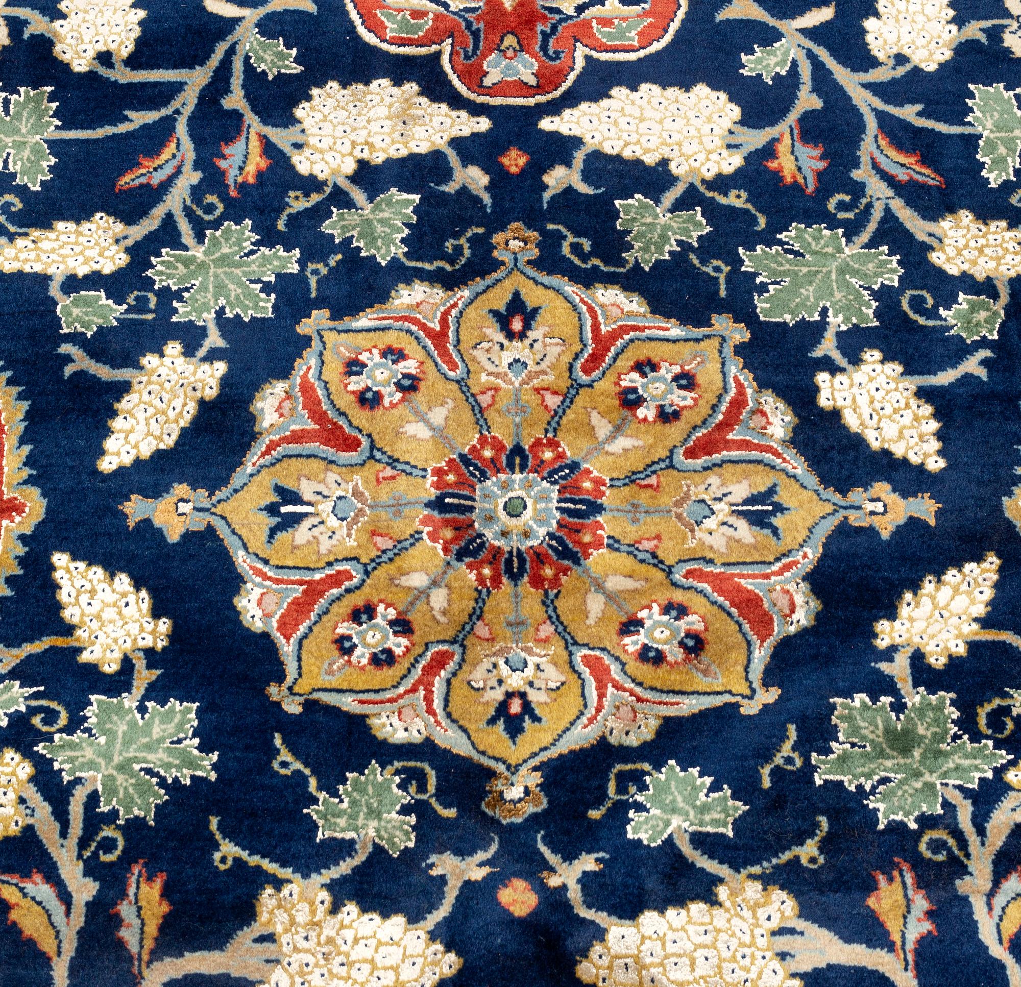 A CARPET so called Royal Kashan, part silk, signed, ca 483 x 311 cm.
