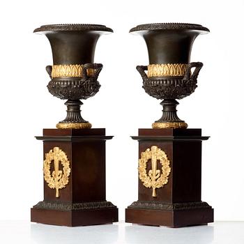 A pair of French Empire early 19th century urns.
