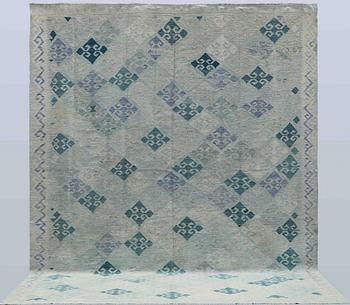 A Kilim carpet, c. 392 x 294 cm.