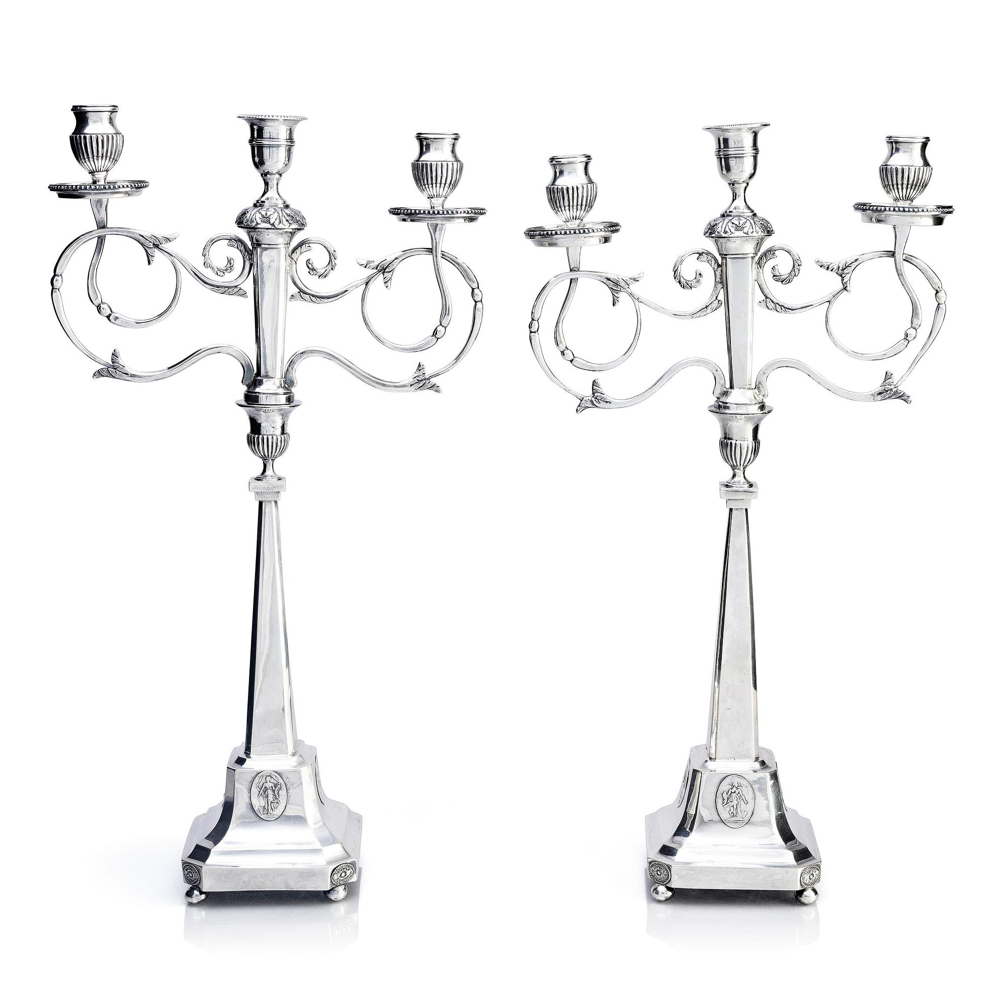 A pair of Swedish silver candelabras, marks of Pehr Zethelius, Stockholm 1797 and Daniel Hedberg, Eksjö 1829.