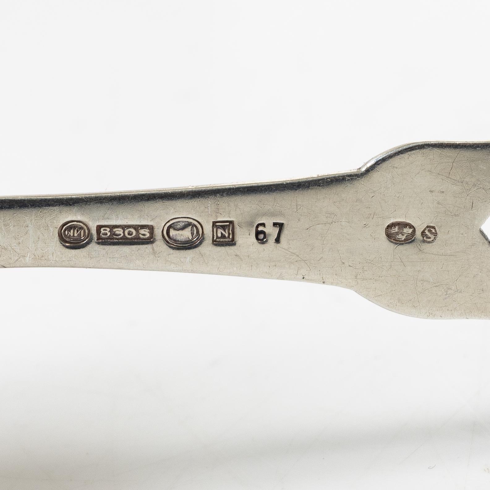 21 pieces of silver cutlery, 1807 - mid 20th century.