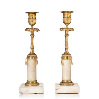 A pair of late Gustavian marble and bronze candlesticks.