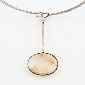 Vivianna Torun Bülow-Hübe, a necklace, silver, with a rutilated quartz pendant. Georg Jensen.