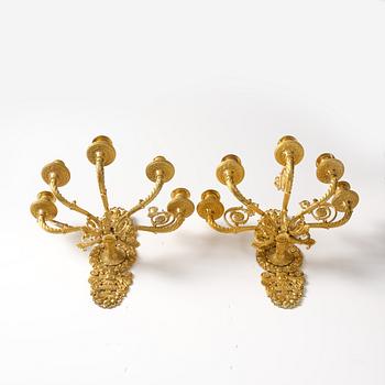 A pair of French Empire ormolu five-branch wall-lights, Paris, early 19th century.