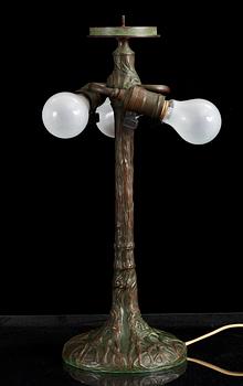 A Tiffany Studios Art Nouveau 'Daffodils' bronze base table lamp, New York circa 1910-15.