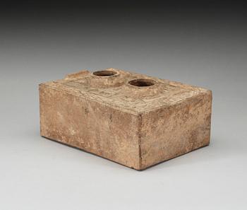 A potted model of a stove, Han dynasty (206 BC - 220 AD).