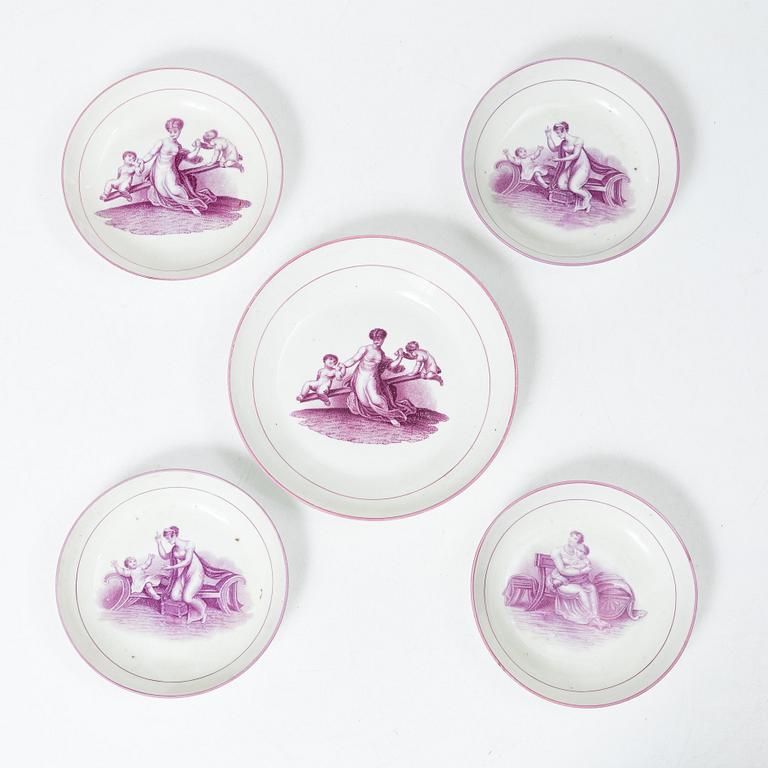 A purple camaieu part coffee service, Early 19th century.
