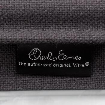 An 'EA 104 Swivel' armchair by Charles & Ray Eames, Vitra, 2007.