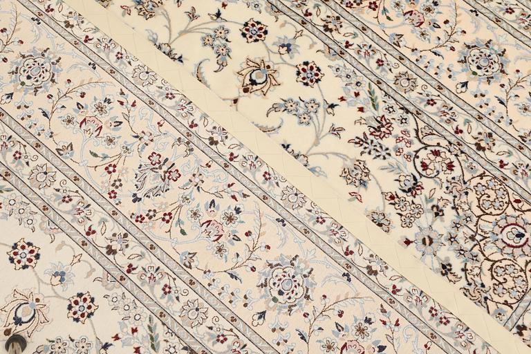 A Nain part silk carpet, c. 207 x 208 cm.
