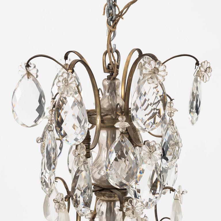 A Rococo style chandelier, early 20th century.