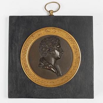 A Swedish Empire ormolu and patinated bronze portrait medallion depicting Karl XIV Johan, early 19th Century.
