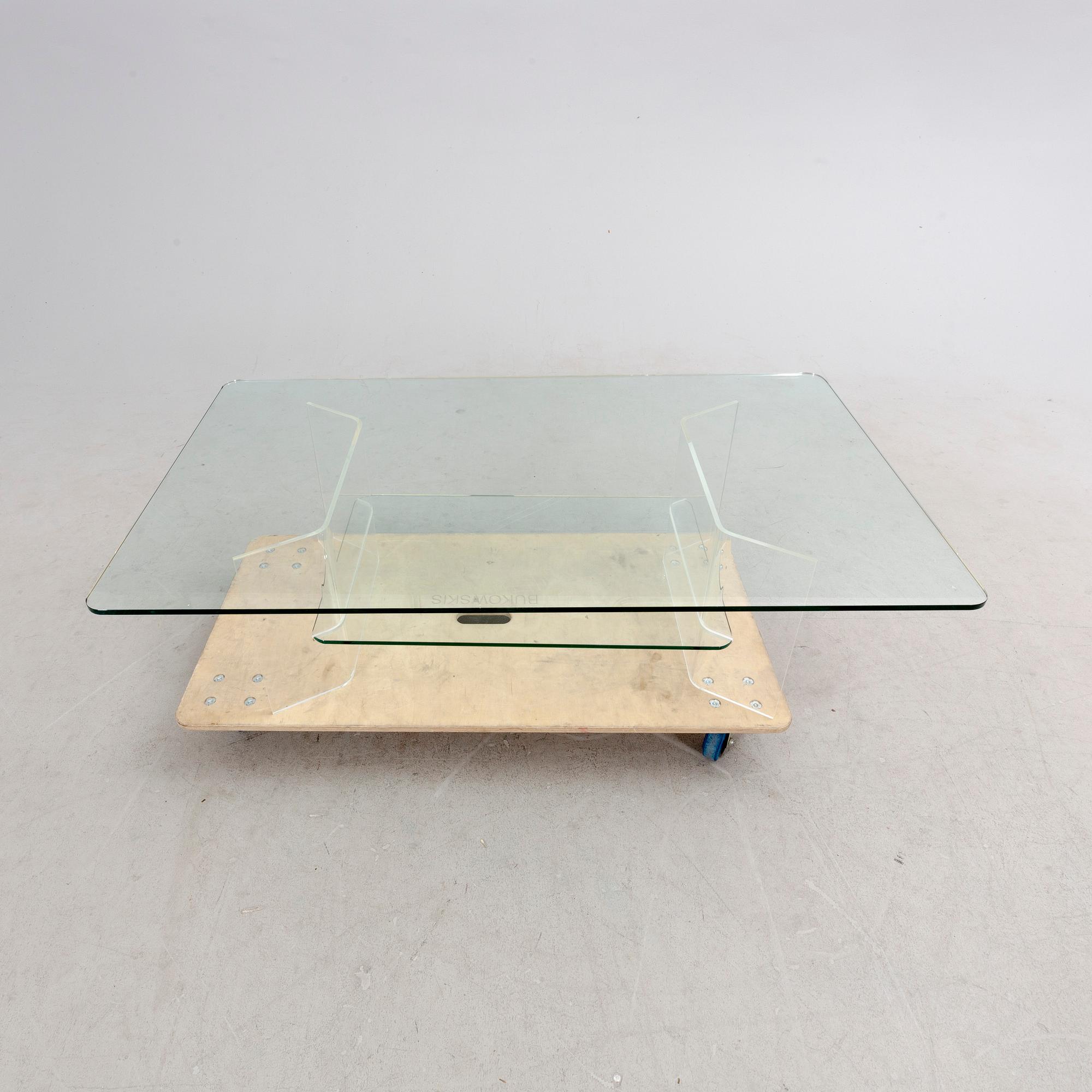 A late 20th century glass and plexi coffee table.