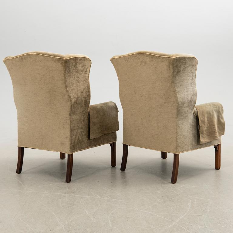 Ear flap armchairs, a pair, England, second half of the 20th century.