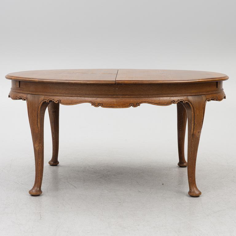 Dining table, 8 chairs, 2 armchairs, sideboard, Rococo style, early 20th century.