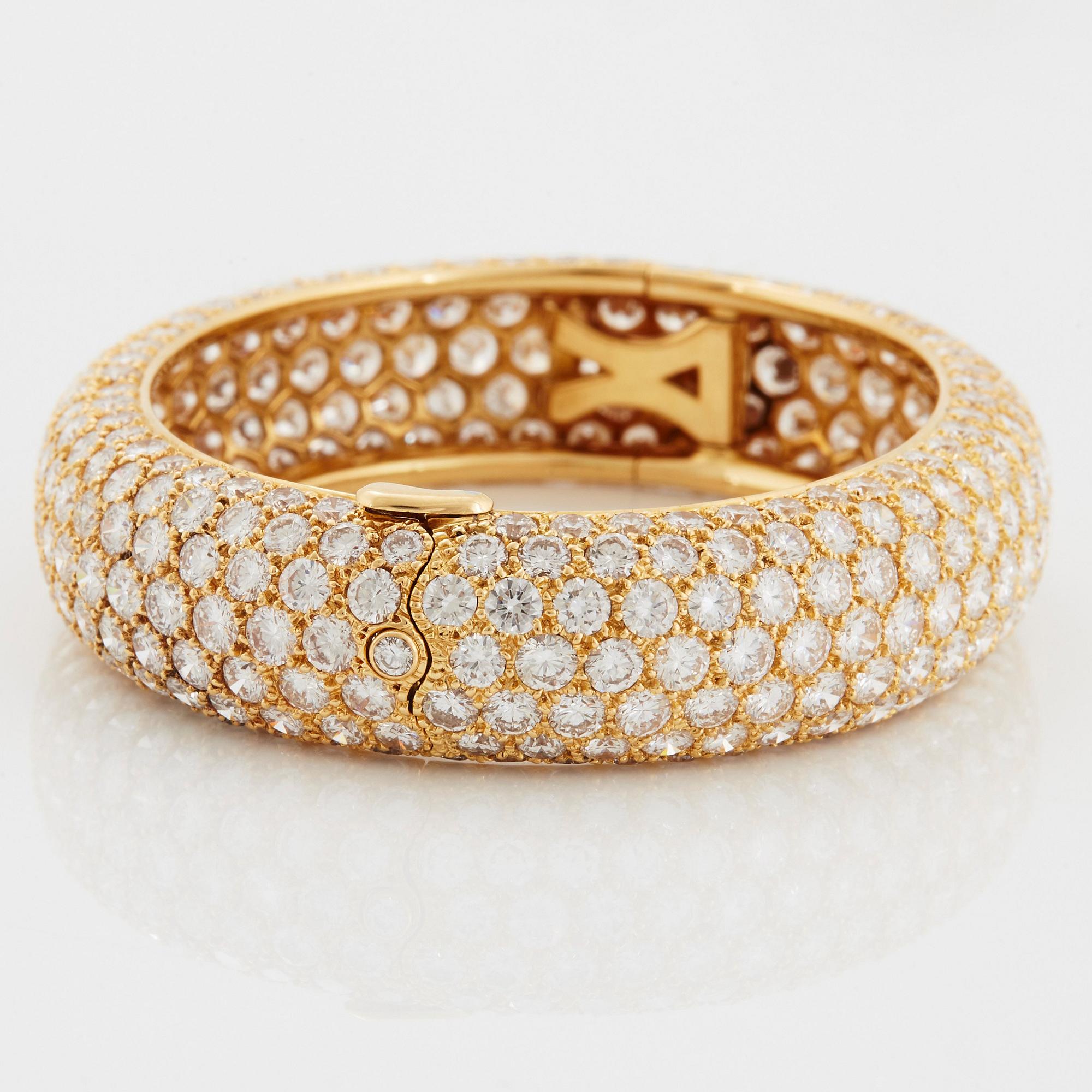 Cartier armring 18K guld med runda briljantslipade diamanter.