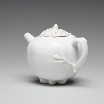 A pomegranate-shaped blanc de chine teapot with cover, Qing dynasty, Kangxi (1662-1722).