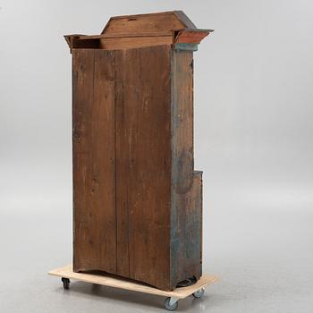 A painted cabinet, dated 1825.