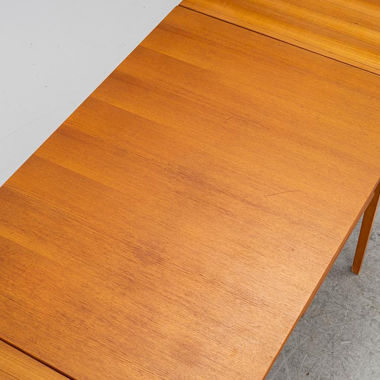 A mid20th century dining table.