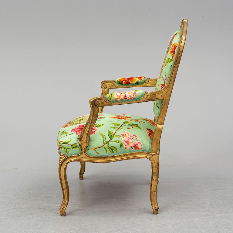 A late 20th century rococo-style armchair.