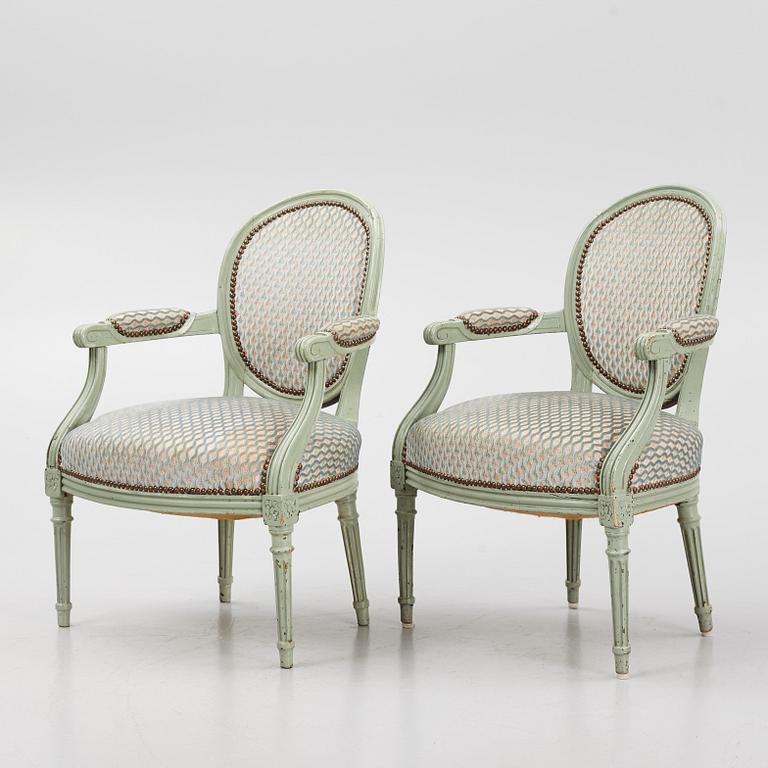 A pair of French Louis XVI open armchairs, late 18th century.