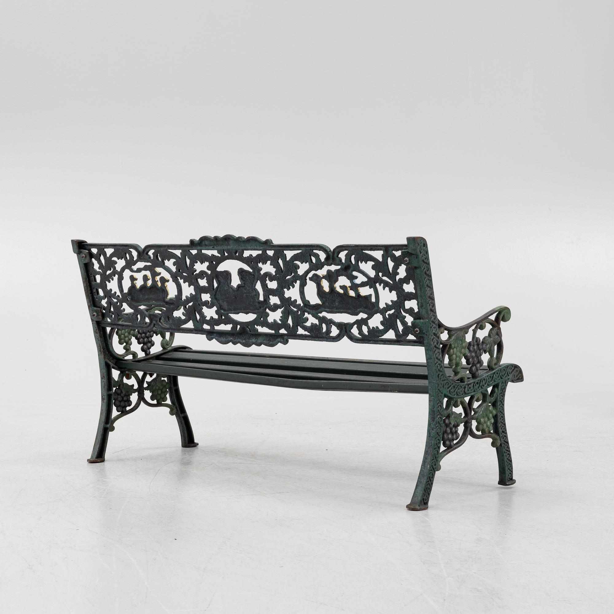 A children's cast iron garden sofa and armchair, mid 20th century.