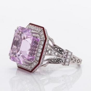 A 14K gold ring with kunzite and diamonds.