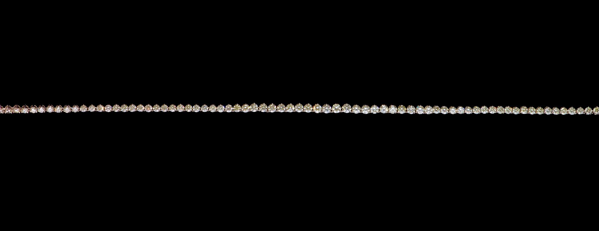 A brilliant cut diamond necklace, tot. 14.70 ct.