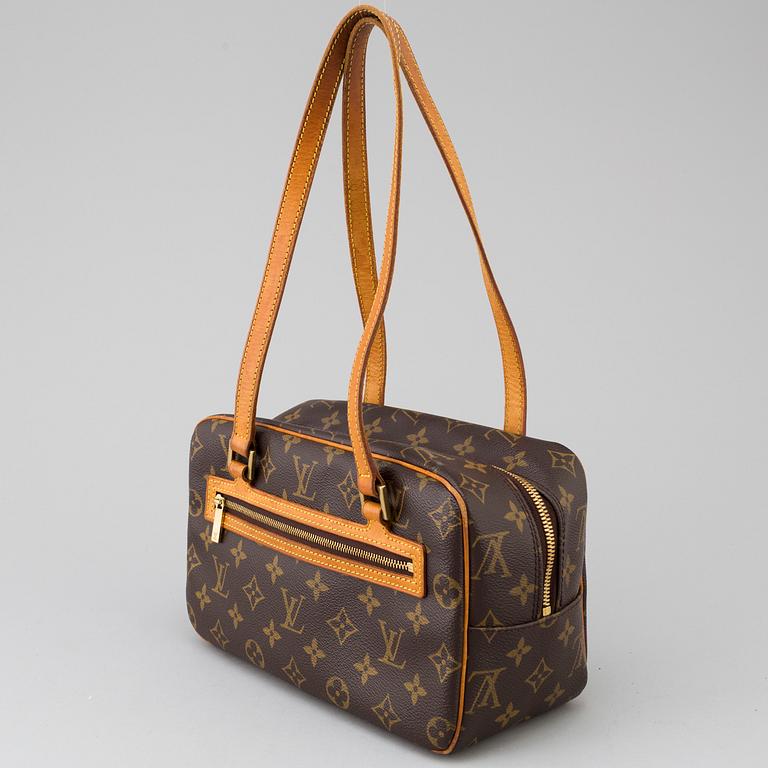 a LOUIS VUITTON ' Cite' bag.