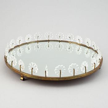 Estrid Ericson,  a mirror and brass table centrepiece from Svenskt Tenn.