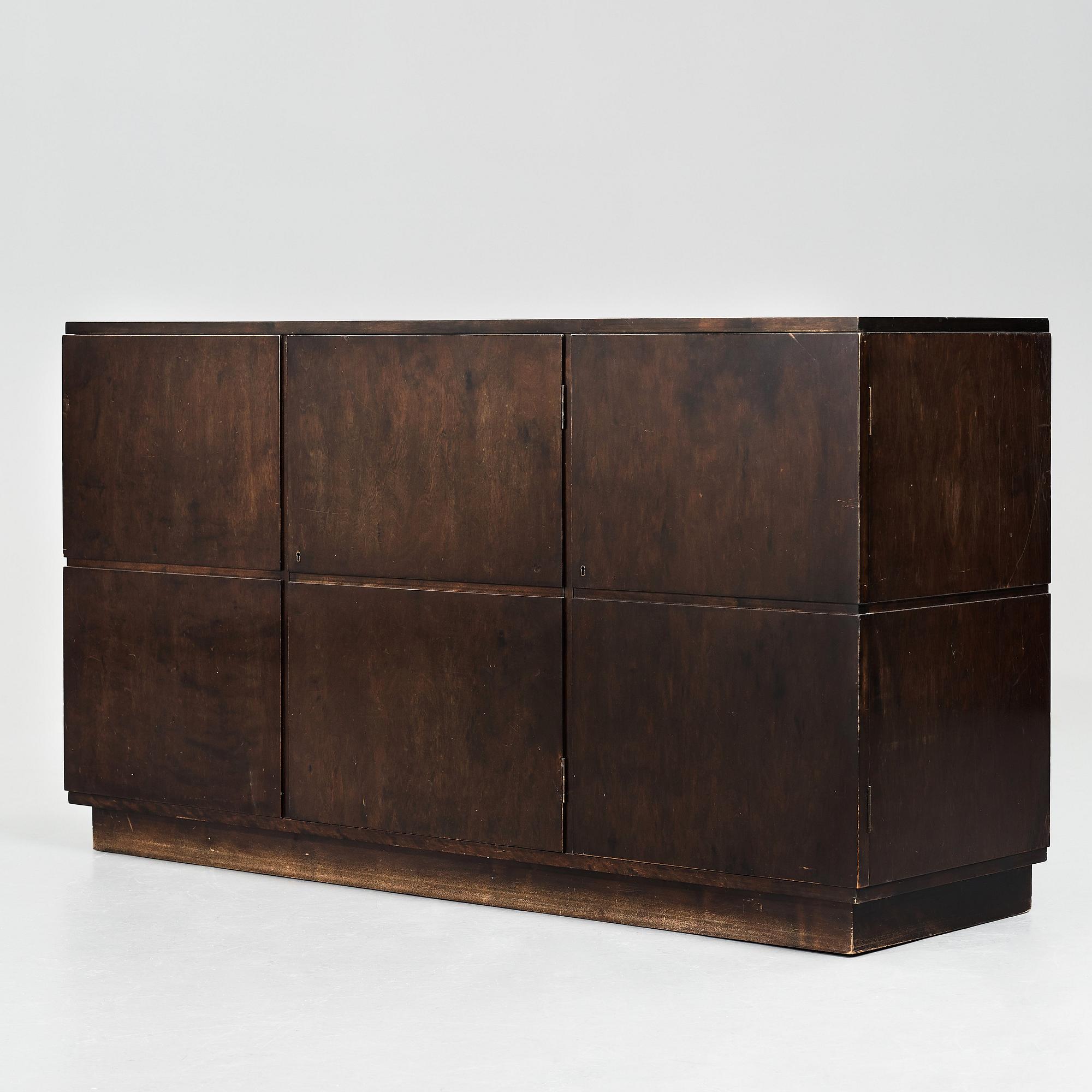 Axel Einar Hjorth, a darkly stained birch sideboard,"Typenko", Nordiska Kompaniet, Sweden 1932.