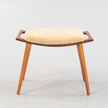 A teak stool with new sheepskin upholstery, 1960s.