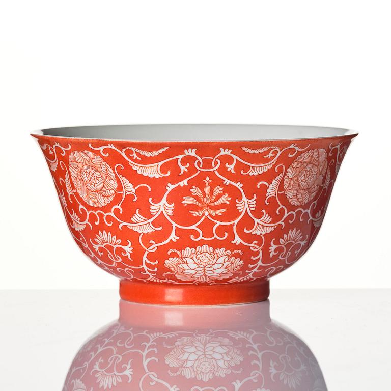 A coral red reserve decorated floral bowl, Qing dynasty with Qianlong mark.