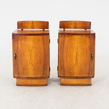 A pair of lacquered walnut bedside tables from the first half of the 20th cenutry.