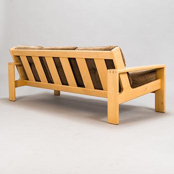 Esko Pajamies, A pair of 1970's 'Bonanza' armchairs, coffee table and sofa for Asko.