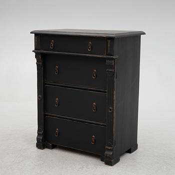 A chest of drawers, circa 1900.