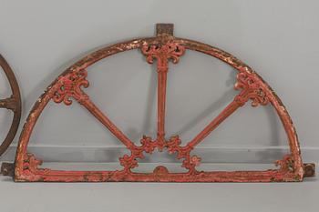 A SET OF THREE CAST IRON WINDOWS.