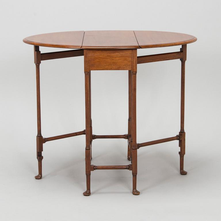 A 20th-century twin-gateleg table, England.